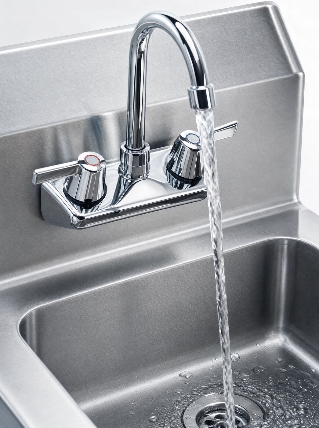Close view of the swivel mixer tap running into the basin